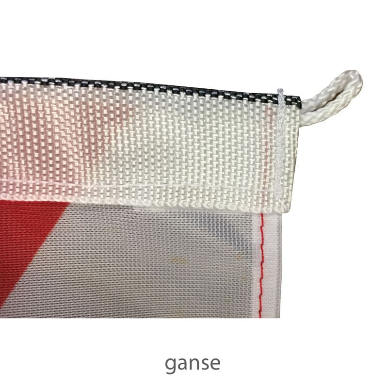 dejean-drapeaux-finition-ganse-oeil-en-drisse-pavillons-nautiques